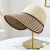 Sombrero de paja a rayas de verano transfronterizo, sombrero de ala ancha para mujer, sombrero de paja elegante para protección solar, sombrero de playa, sombrero tejido