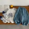 Top de cuello redondo versátil estilo coreano para niños con mangas raglán a rayas de otoño y pantalones largos a rayas casuales para niños ropa infantil