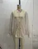 Moda femenina europea y americana transfronteriza INS2026 elegante camisa transparente de encaje con retazos de manga larga asimétrica
