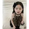 Ropa Infantil Estilo Coreano 2026 Verano Nuevo Conjunto para Niñas Chaleco Elegante con Estampado de Leopardo Falda Negra de Pastel para Niños Conjunto de Dos Piezas
