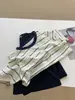 Camiseta de manga corta a rayas frescas estilo americano para mujer, talla grande, nuevo modelo de verano 2026, holgada, adelgazante, top versátil