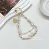 Cadena para Teléfono con Cuentas de Atmósfera de Primavera y Verano Cola de Pez Festoneada Moda Diseño de Nicho Colgante Versátil Exquisito Retro
