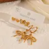 Conjunto de Brincos em Aço Inoxidável em Formato de Coração, Brincos Femininos Banhados a Ouro 18K Transfronteiriços com Acabamento de Luxo, Acessórios de Orelha com Laço
