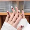 Uñas Portátiles de Alta Gama para Año Nuevo: Rojo Retro Cisne Puntos, Ojo de Gato Francés, Moño, Brillo Deslumbrante, Manicura Hecha a Mano que Realza el Cutis