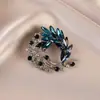 Broche de estilo antiguo nuevo de alta gama ins para mujer estilo chino abanico borla pin de traje cheongsam tapeta de presión corsage al por mayor