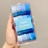 Goma para el pelo elástica al por mayor en caja para niñas coleta alta cuerda para la cabeza goma para el pelo cubierta de cuero nuevo color banda para el pelo cuerda para el pelo