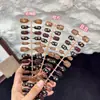 Tiras para Uñas Florales Negras Doradas Vintage Retro 30 Piezas Nuevo Estilo Xiaohongshu Más Vendido Uñas Postizas Gato de la Suerte
