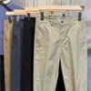 Overol estilo Hong Kong de otoño microelástico holgado recto pequeño pantalones casuales versátiles para hombre cómodos simples pantalones cortos de moda