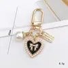 Joyería de Cuentas Nuevo Colgante de Corazón de Perla Llavero Colgante para Bolso Regalo Pequeño para Estudiantes Cadena Colgante para Funda de Teléfono Móvil para Mujeres