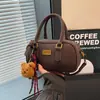 Bolso de Mano Pequeño Transfronterizo para Mujer 2025 Nuevo Otoño e Invierno Bolso Bowling de Viaje Bolso de Hombro Cruzado Versátil Retro