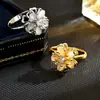 Anel feminino de flor de opala com pedra incrustada, novo, transfronteiriço, moda fada, requintado, abertura, rotativo, descompressão, dedo