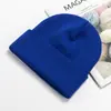 Venta al por mayor del fabricante Gorro cálido de moda para otoño e invierno, Gorro de punto a prueba de frío, Color sólido para exteriores, Protección para las orejas, Gorro de lana, Logotipo bordado