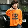 Camiseta casual para crianças mais velhas, top versátil, estilo celebridade da internet da moda, novo modelo primavera/outono, design de desenho animado legal e estiloso, manga longa de algodão puro para meninos