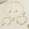 Set de joyería europeo y americano transfronterizo, collar con diseño de trébol de cuatro hojas geométrico con goteo de aceite, aretes y pulsera versátiles y elegantes