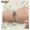 Pulsera de aleación de estilo étnico chino, accesorio metálico de nicho con flor de loto y sensación de alta gama, decoración al por mayor