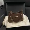 Bolsas de Alto Valor Estético para Mujer Primavera 2026 Nuevo Bolso de Hombro para Viaje Diario Moda Simple Diseño de Nicho Bolso Tote Pequeño de Hombro Único