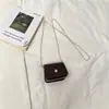 Mini Bolsa de Selim Feminina Primavera 2026 Nova Carteira de Moedas Estilo Coreano Casual Bolsa para Fones de Ouvido Bolsa de Ombro Único Transversal