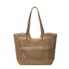 Nuevo bolso de hombro grande tejido de paja de moda 2026 para mujer, bolso tote hueco casual y versátil, bolso de playa simple