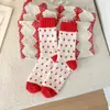 2025 nuevas populares calcetines de invierno cálidos de rizo gruesos resistentes al frío calcetines rojos para mujer