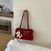Bolso baguette para mujer, nuevo modelo primavera 2026, piel de cera roja, bolso de hombro moderno y versátil, bolso de axila estilo vintage biker