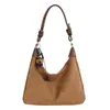 As bolsas pequenas populares deste ano para mulheres, versáteis para outono e inverno 2023, nova bolsa estilosa de ombro único e transversal, bolsa de mão feminina, bolsa de bolinho