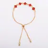 Pulsera de trébol de cuatro hojas con cruz de circonita para mujer, dulce, de alta gama, nicho, versátil para Instagram, joyería para mano con flor