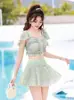 Traje de baño para mujer, verano 2024, nuevo diseño de explosión que cubre el vientre, adelgazante, puro deseo, viento dividido, estudiante conservador, hada, abanico, traje de baño de pecho pequeño.