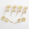 Accesorios diy material hecho a mano fábrica al por mayor latón bañado en oro Rama de Flor broche para mujer accesorios de corsage