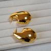Pendientes de latón chapados en oro de alta calidad con forma de gota de agua hueca, lisa, con personalidad de nicho exagerada de Europa y Estados Unidos
