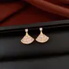 Pendientes de borla con flor de trébol de circonita vintage con un toque de alta gama, pendientes versátiles y de moda al por mayor