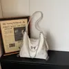 Bolsa Tote Feminina Nova Moda Primavera 2026 Textura Bolsa de Ombro Simples Design de Nicho Bolsa Casual Tendência
