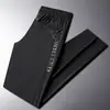 Calça casual masculina de verão nova, de alta qualidade, respirável, elástica, secagem rápida, seda gelada, calça esportiva casual de marca da moda, calça de ar condicionado
