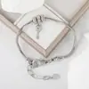 Europa y Estados Unidos superventas todo a juego personalidad hueco incrustado circonita vintage llavero pulsera moda exquisito temperamento pulsera