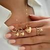 Europa y Estados Unidos transfronterizo nueva moda creativa amor corazón aretes anillo collar traje sentido del diseño joyería de alta gama para mujer