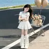 Conjunto de Falda de Verano Nuevo Estilo Academia para Niñas Coreano Dulce Lindo Dibujos Animados Camisa POLO Falda Corta de Encaje Conjunto de Dos Piezas