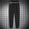 Calça Esportiva Casual Masculina Processada para Primavera Corrida Fitness Stretch Calças de Moletom Masculinas Skinny Apertadas Cor Sólida
