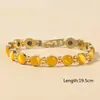 Pulsera de ojo de gato con baño de oro de 18 quilates, cruzada europea y americana, TK, superventas, pulsera magnética de moda y tendencia para mujer, venta al por mayor desde el fabricante