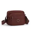 2026 Nova Bolsa Feminina de Cor Sólida Tendência Moda Cor Sólida Ombro Único Transversal Simples Bolsa Feminina de Nylon Casual Pequena Quadrada