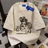 Camiseta de algodón puro de peso pesado con estampado de dibujos animados, estilo unisex suelto y de corte ajustado, teñido anudado, cuello redondo, manga corta para hombres y mujeres, top estilo pareja