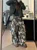 Pantalones de camuflaje patchwork de estilo americano transfronterizo con letras y estrellas, de corte holgado unisex de moda, de pierna ancha curvada de alta costura, pantalones vaqueros casuales