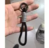 Pulseira de pulso tecida em duas cores, alça curta de tecido de alta qualidade, porta-copos resistente, bolsa transversal simples para celular com clipe traseiro e cordão