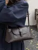Bolsa baguette de nicho super popular para outono e inverno, novo estilo 2026 para mulheres, bolsa de ombro única/sob o braço da moda para o trabalho, bolsa de mão para atividades ao ar livre