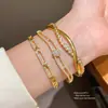 Pulsera Redonda con Hebilla de Pedrería Pulsera de Muñeca de Lujo Ligero y Alta Gama 2026 Nicho Versátil para el Viaje Diario Joyería de Mano al por Mayor