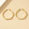 Corea del Sur Dongdaemun moda pendientes geométricos simples de círculo diseño de nicho femenino pendientes irregulares pendientes al por mayor