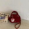 Bolsa Pequena Feminina Estilo Japonês e Coreano Doce 2026 Nova Versátil Acolchoada Bordada Bolsa de Mão Ombro Transversal Bolsa Pequena