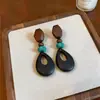 Aretes redondos de madera con poste de plata estilo étnico, aretes simples de moda de nicho de alta gama, accesorios de oreja exquisitos versátiles vintage