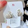 Pendientes de botón de flor de tulipán con pasador de plata 925 para mujer, de alta gama, personalidad, más fáciles de combinar, moda nicho, pendientes de lazo, venta al por mayor