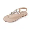 Sandalias de mujer talla grande 2026 verano nuevo sandalias de dedo planas de strass bohemias zapatos de playa antideslizantes