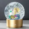 Decoración de escritorio tipo globo de nieve para cuidado de la piel de lujo regalo artesanía de resina regalo para clientes bola de cristal personalizada