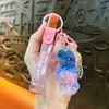 Llavero creativo de concha pequeña con aceite, lindo colgante pequeño de arena movediza líquida, accesorios para bolso, pequeño colgante de regalo, venta al por mayor